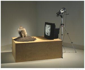 Obj. No. 2000.96a-g Photo No. 53946.CT.1 Nam June Paik (American, born Korea, 1932-2006) Buddha Watching TV, 1974-97 Stone sculpture, soil, closed circuit video camera, video monitor, tripod, and plywood base Note: signed and dated in white paint on Buddha's head. The work was conceived in 1974 and first made in 1997 to show at the Goethe-Institut New York on the occasion of Paiks Goethe Medal award. Following collection and photo credit lines must appear with image: Virginia Museum of Fine Arts, Richmond. Gift of the Friends of Frances and Sydney Lewis, in memory of Sydney Lewis, and in honor of the grand reopening of the Sydney and Frances Lewis Galleries of Modern and Contemporary Art. Photo: Katherine Wetzel © Virginia Museum of Fine Arts