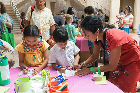 A family enjoys arts & crafts at VMFA's Latin America Family Day