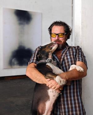 Julian Schnabel, with Tina, in his studio in Brooklyn.