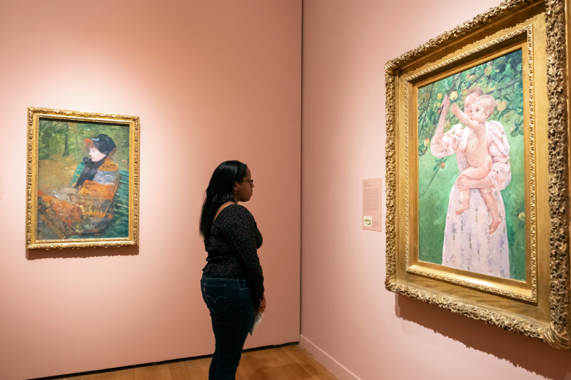 Among the 16 Mary Cassatt paintings showcased in the exhibition: Profile Portrait of Lydia Cassatt (left), 1880, Petit Palais, Musée des Beaux-Arts de la Ville de Paris, and Child Picking Fruit (left), 1893, Virginia Museum of Fine Arts