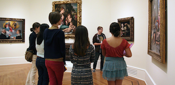 People looking at Paintings