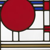 <p>Go upstairs to the Art Deco Galleries to find this brightly colored, functional work of art. This artist combined lots of geometric-shaped pieces of glass to make this window. Name the largest shape.</p>
