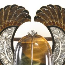 <p>Get decked out in the Art Deco Galleries on Level 3 with this brooch fit for a pharaoh. Who made the brooch?</p>
