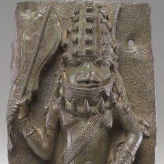<p>African Galleries, Level 2</p>
<p>The royal regalia of this Benin Chief, including a paddle-shaped sword, leopard-tooth necklace, and other rich apparel, communicate his power and status within Benin culture. What else about him tells us he is powerful?</p>
