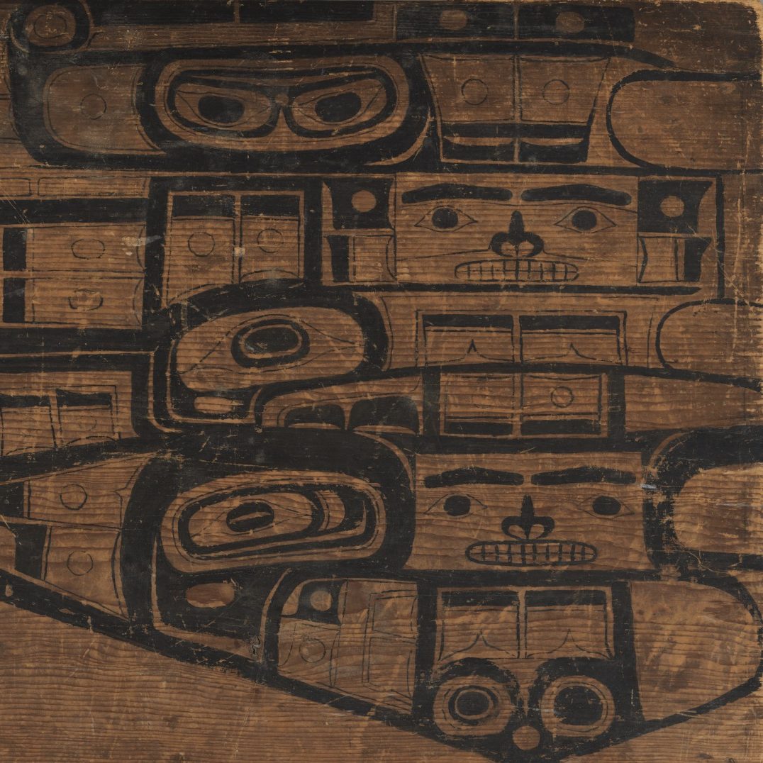 <p>How would you describe the shapes in this nearby work made of painted wood? Why do you think this work is displayed near the Chilkat blanket? Do the designs match? Could you extend the pattern that you see on the board?</p>
<p>How would you compare the way the blanket was made with the way that Esther Mahlangu created her murals?</p>
