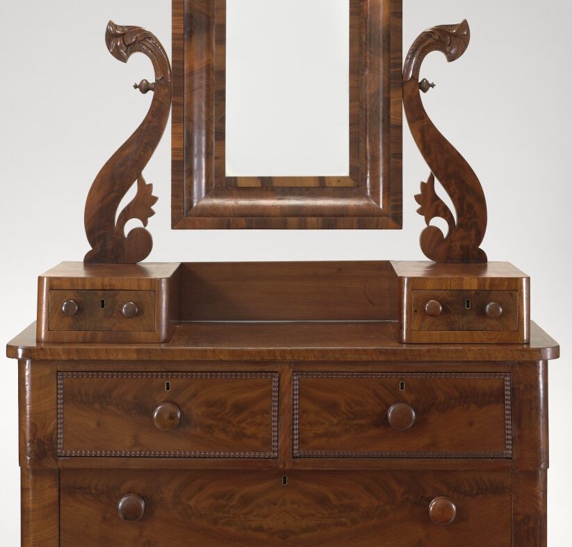 <p>Visit the American Art Galleries on Level 2 to find this Dressing Bureau. Experts believe it was made by Thomas Day, an African American cabinetmaker and business owner who was born into a free Black family in Virginia in 1801. How many different shapes can you find that make up this Dressing Bureau? </p>
